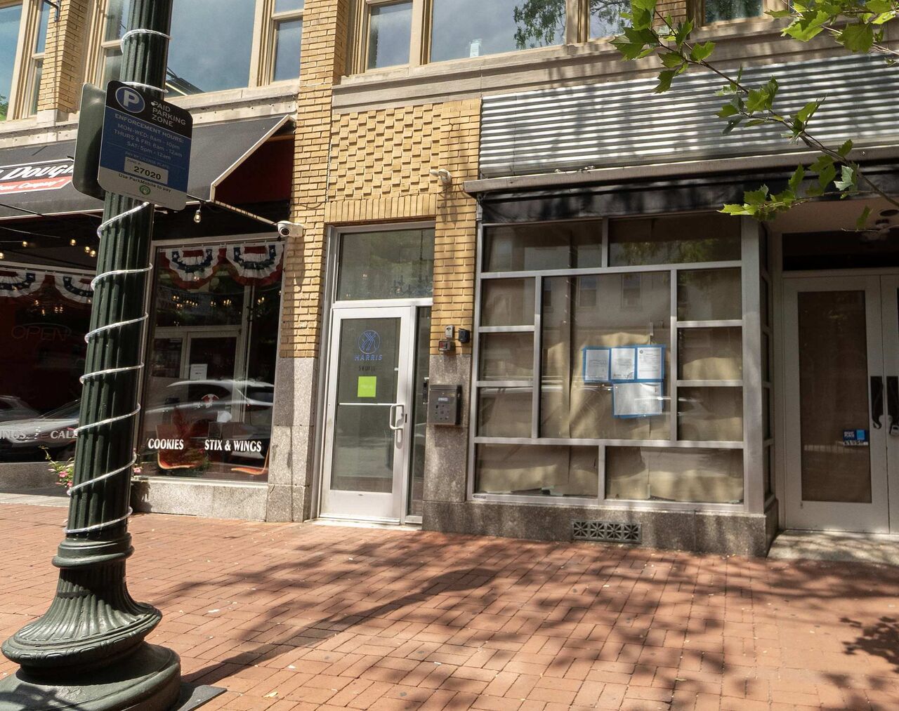 The street door at 5 West Gay Street, a glass door between the ground-floor shopfronts